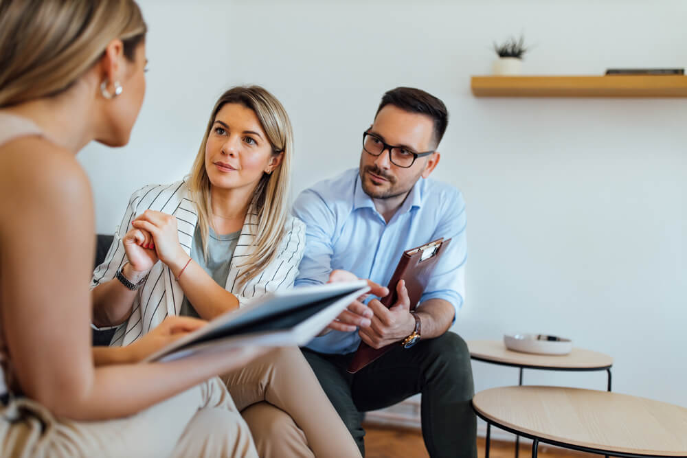 Insurance agent giving advise to a couple