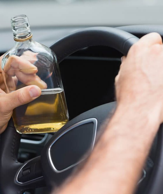 Man drinking alcohol while driving in his car - Acceptance, cheap business insurance