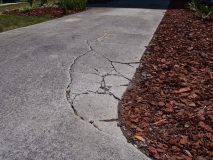 Cracked sunken concrete driveway repair - Acceptance, cheap business insurance