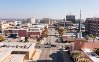 Afternoon aerial skyline view of downtown Bakersfield, California, USA – Bakersfield, cheap car insurance in California.
