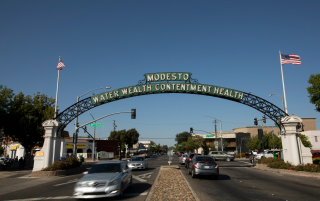 Daytime view of the historic 1912 Modesto Arch – Modesto, cheap car insurance in California