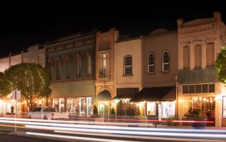 Night time traffic streams through historic downtown Red Bluff –cheap car insurance in California.