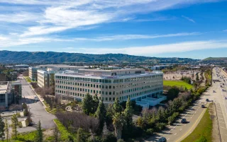 Oracle building in Pleasanton, California on a beautiful winter day with a blue sky with clouds, USA – Pleasanton, cheap car insurance in California